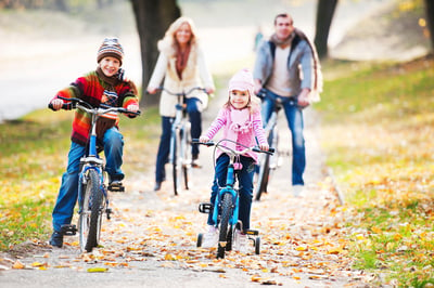 Family riding bikes